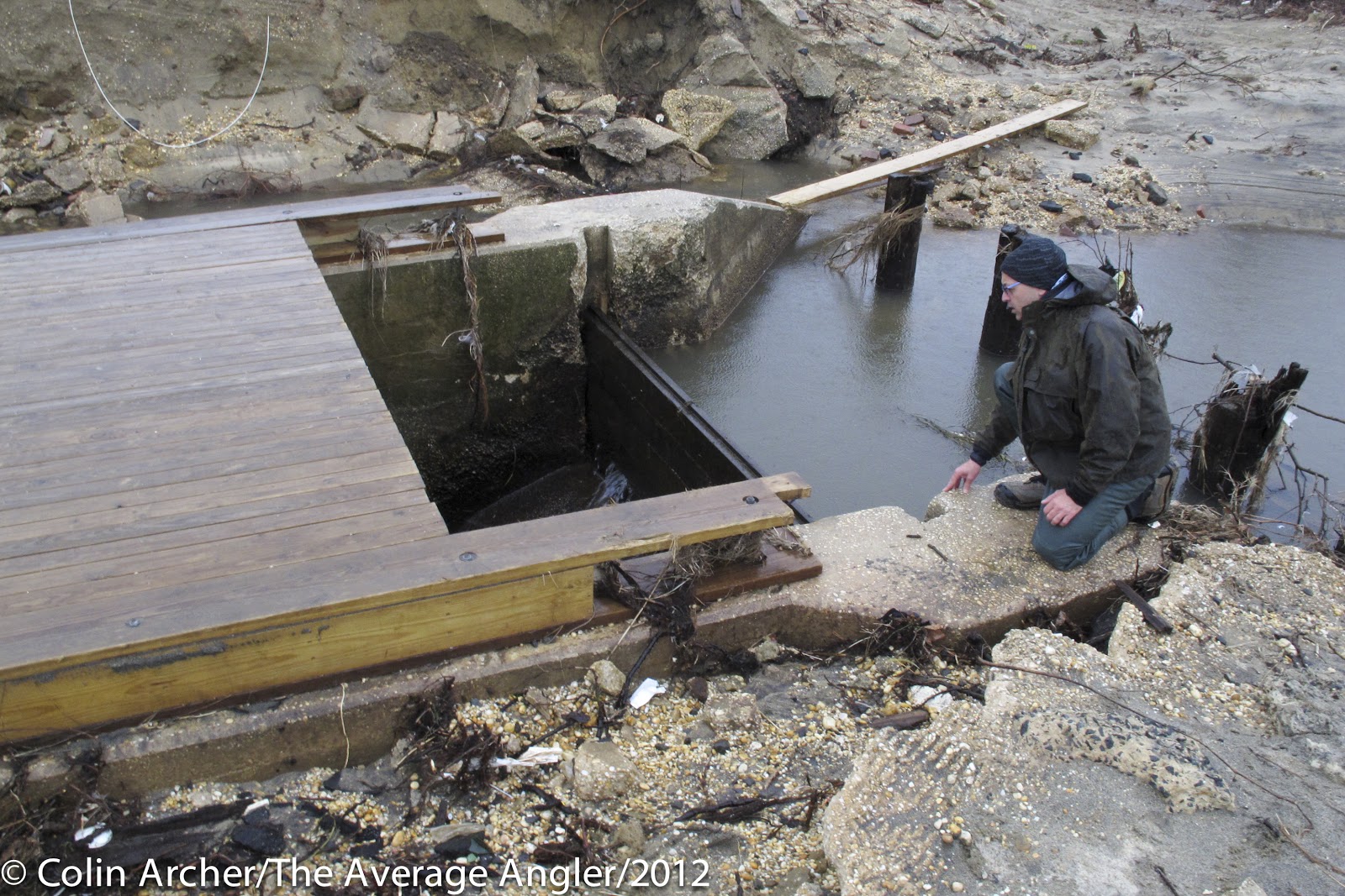 Paul Eidman checking a spot for restoring river herring access point.