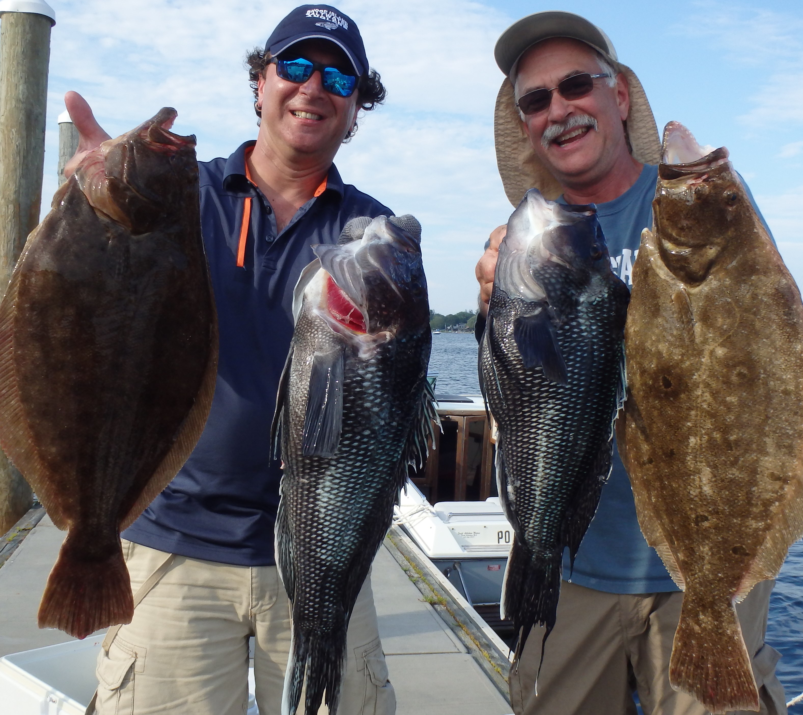 Steve Brustein of Portland, ME and Kevin Fetzer of East Greenwich, RI with some of the fluke and black sea bass they caught off Block Island thanks to the healthy bio mass of both species.