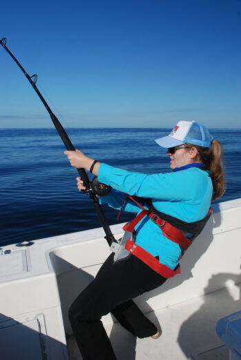 Lisa Crawford leaning into a 250-class thresher shark off Fire Island, NY