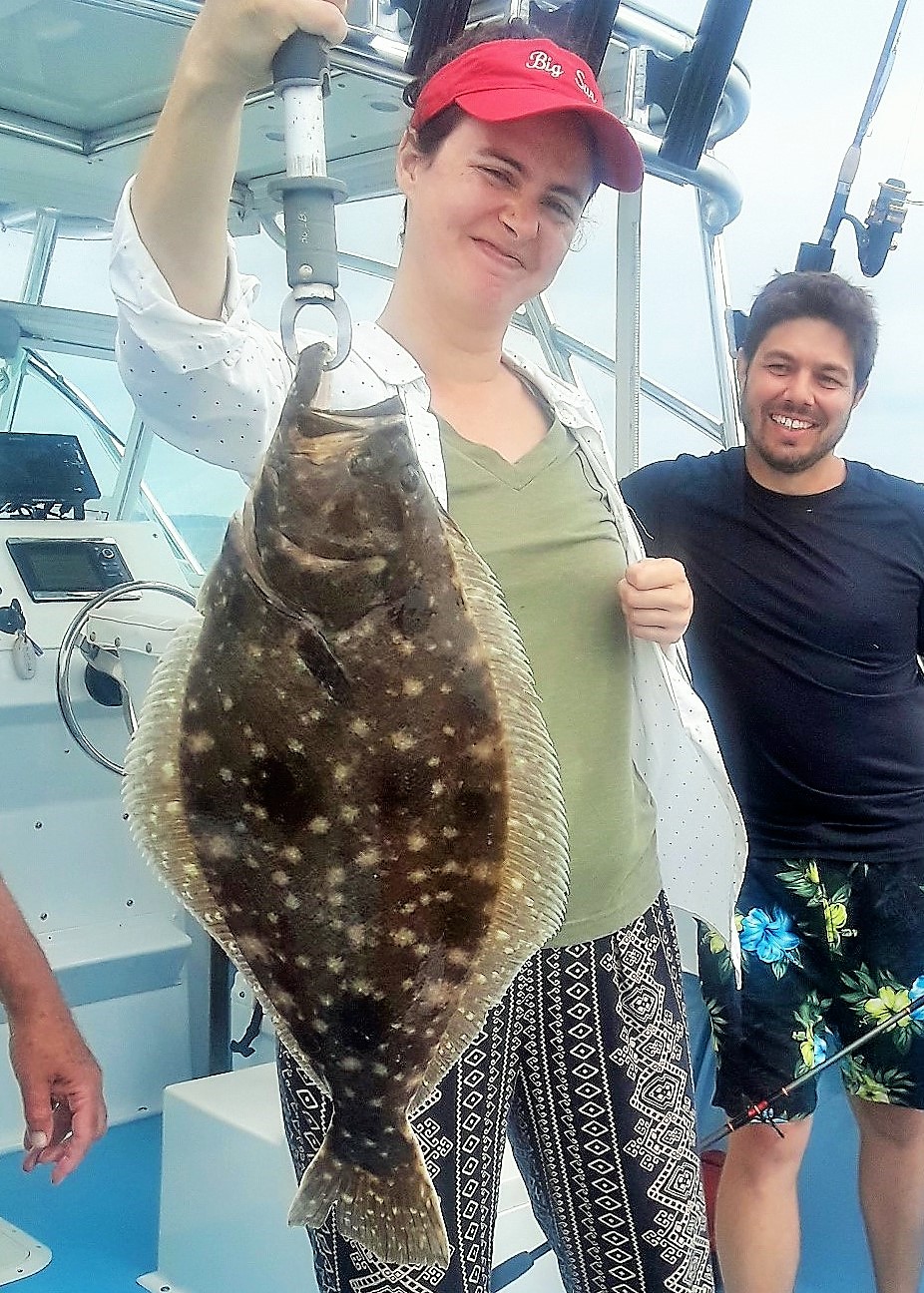 Lucy Churchill with a 24” summer flounder (fluke) she caught off Rhode Island this summer. Fluke stock is in a slump coastwise, however, scientists say the biomass has moved north.