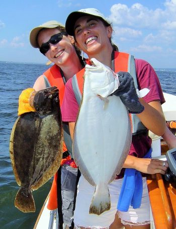 Allison Harper and Jennifer Monti with summer flounder they caught off Rhode Island due in part to a stock that rebuilt with a strong MSA and NOAA National Marine Fisheries Service.