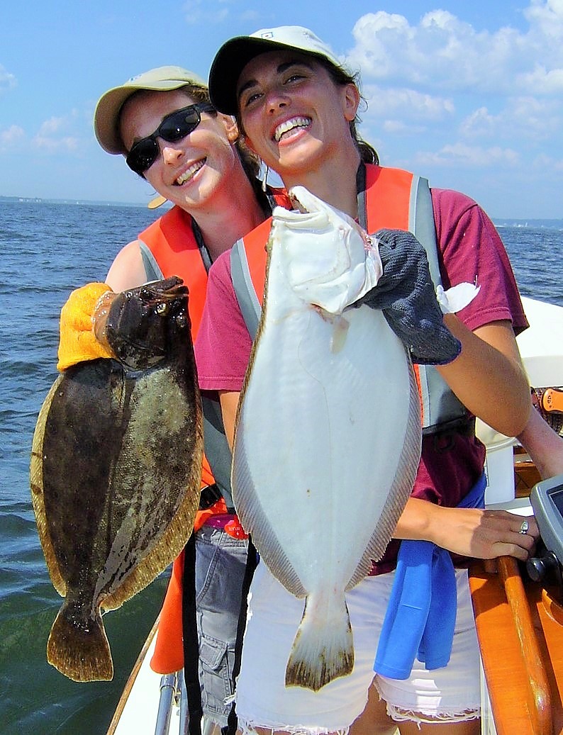 Allison Harper and Jennifer Monti with summer flounder they caught off Rhode Island due in part to a stock that rebuilt with a strong MSA and NOAA National Marine Fisheries Service.