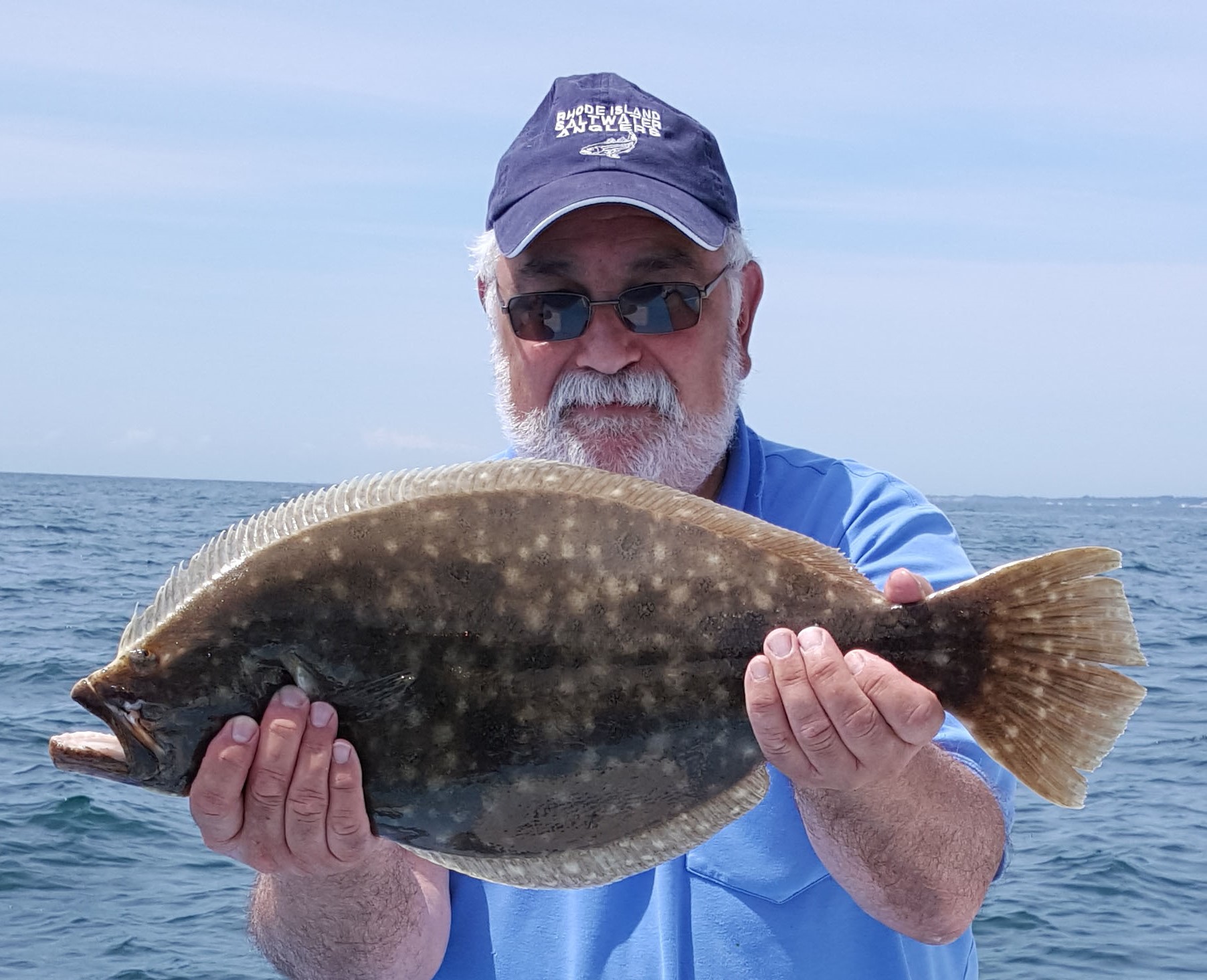 Steve Medeiros (with summer flounder), president of the RI Saltwater Anglers Association, represents 7,500 affiliated recreational anglers and 30 fishing clubs and associations.