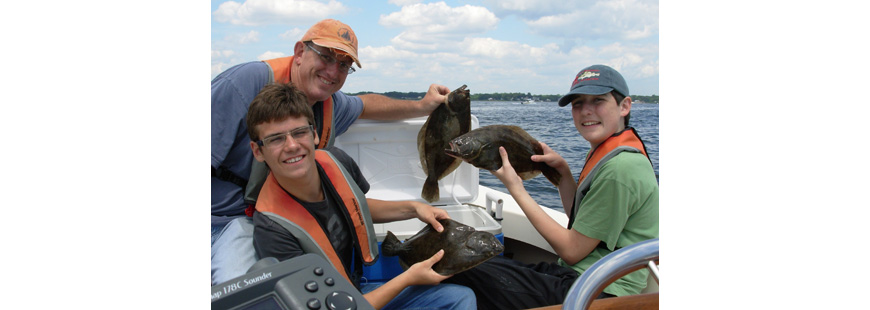 Dr. Jonathan Hare shown in 2013 with his son Jon (far right) and friend Elliot Emperor fishing with Capt. Dave Monti on No Fluke Charters.