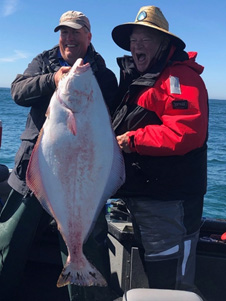 An unmistakable smile: Todd Liebow with his first Pacific Halibut
