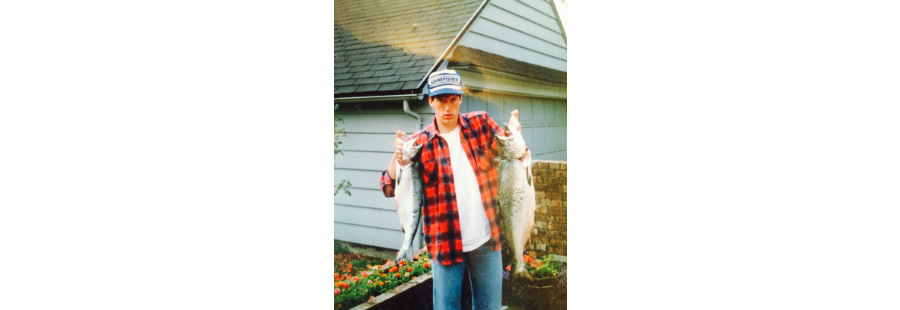 A young Bob Rees holding a couple of ocean caught salmon out of Westport, Washington